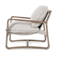 Side view of the Natural sling chair with loose cushions and continuous wood sled supports