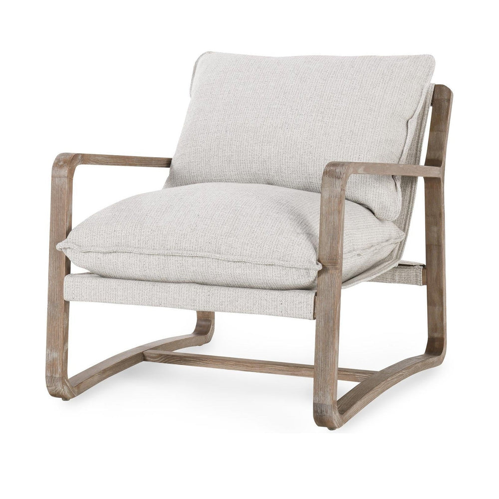 Natural upholstered sling chair with loose cushions and an open wood sled frame