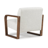 Rear three-quarter view of the Coastal Breeze chair's upholstered back and open ash frame