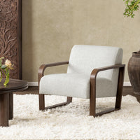 Coastal Breeze accent chair styled on a white shag rug beside a low round table