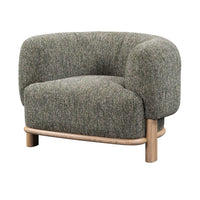 Green barrel-back accent chair with textured upholstery and an exposed ash base