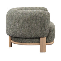 Rear three-quarter view of the Green chair's broad back and ash supports