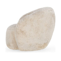 Side view of the Sand swivel chair's rounded back and long-pile upholstery