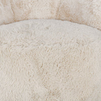 Close-up of the Sand chair's long-pile upholstery at the seat and inner back