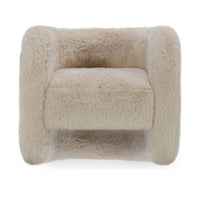 Front view of the Sand faux fur chair with broad rounded arms and an open lower front