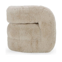 Side view of the Sand faux fur chair showing the opening beneath its rounded arm
