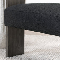 Charcoal seat and oak-veneered front support detail, styled on a pale rug
