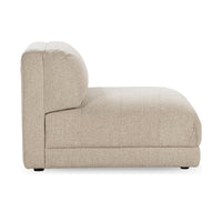 Side view of the Buttermilk armless chair showing its deep seat and low base