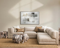 Buttermilk seating styled as a large sectional with a chaise and sculptural coffee table