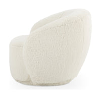 Side view of the Vanilla chair's rounded back and fully upholstered base