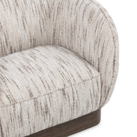 Close-up of the Cocoa Cream chair's curved inner back, seat and brown-streaked fabric