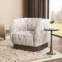 Cocoa Cream swivel chair styled on a patterned rug beside a slender side table