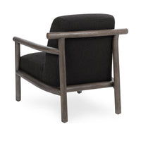 Rear three-quarter view of the charcoal chair showing the wood back rail and posts