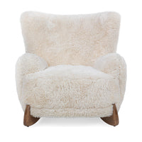 Front view of the Vanilla wingback chair with rounded arms and shaped ash feet