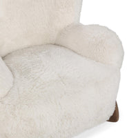 Close-up of the Vanilla chair's plush seat and rounded inner arm