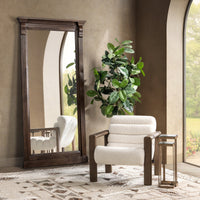 Ivory Fleece wood-arm chair styled beside a tall mirror and potted plant