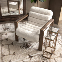 Elevated view of the Ivory Fleece chair styled beside nesting tables on a patterned rug