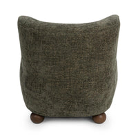 Rear view of the Winter Fir wingback chair with a flared top and wood feet