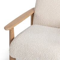 Beige Natural chair seat detail showing textured fabric beside the wooden arm