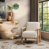 Beige Natural accent chair styled beside a wood console and tall window