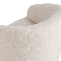 Close-up of the Toasted Linen chair's curved outer back and woven upholstery