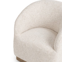 Close-up of the Toasted Linen chair's seat, curved back and sloping arms