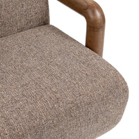 Close-up of the Warm Mocha chair's textured seat and rounded wood arm