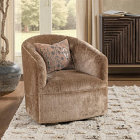 Walnut Heather swivel chair styled with a patterned pillow beside a window