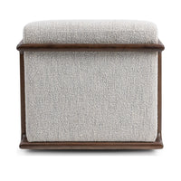 Rear view of the ivory swivel chair with its upholstered back outlined by wood rails