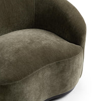 Close-up of the Olive Moss chair's rounded seat and curved inner back