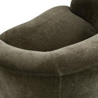 Overhead detail of the Olive Moss chair's curved arm and rounded seat