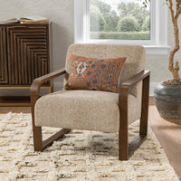 Almond Husk accent chair styled with a patterned pillow beside a window