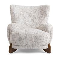 Front view of the Canvas Oat wingback chair with rounded arms and shaped ash feet
