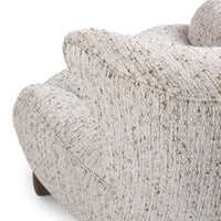 Close-up of the Canvas Oat chair's rounded outer arm and flecked upholstery