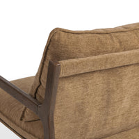 Rear detail of the Honey Oat chair's back cushion, fabric panel and wood frame