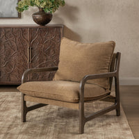 Honey Oat wood-frame chair styled on a rug beside a carved cabinet