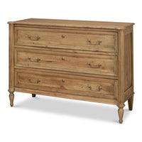 Transitional three-drawer acacia chest in driftwood finish with solid cast brass bail pulls, paneled fronts, and turned tapered legs
