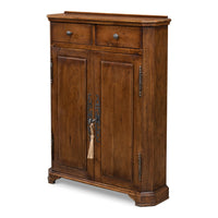 Tall traditional hall cabinet in acacia with fruitwood finish, paneled doors, and forged iron escutcheon hardware
