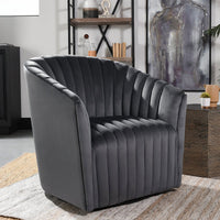 Gray channel-tufted swivel chair styled on a rug beside a side table