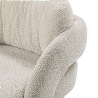 Close-up of the Natural chair's curved arm and textured back cushion