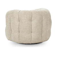 Rear view of the beige swivel chair with tufting across its curved back