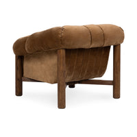 Rear three-quarter view of the Bronze chair showing its upholstered back and oak frame