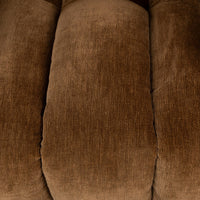 Bronze fabric detail showing a padded upholstery channel