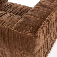 Overhead detail of the Bronze chair's padded back and wide ruched arm