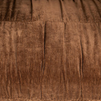 Bronze upholstery detail with vertical gathers and horizontal stitching