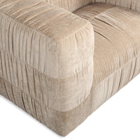 Close-up of the French Vanilla chair's broad arm and softly gathered seat