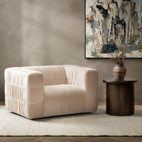 French Vanilla ruched swivel chair styled beside a round table beneath abstract wall art