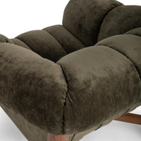 Close-up of the Olive Green chair's broad rolled arm and channel-tufted seat