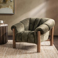 Olive Green channel-tufted chair styled on a woven rug beside a round table