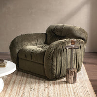 Olive Green gathered chair styled beside a slender side table on a woven rug